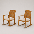 Studio | three-quarter view of two slatted acacia rocking chairs with cream cushions