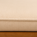 Close view | cream woven cushion texture, sewn edge and acacia seat rail