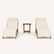 Front | front studio view of two ivory-cushioned acacia chaise lounges with a folding side table
