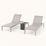 Three-quarter studio | both light gray mesh chaise lounges and woven-top side table on off-white paper