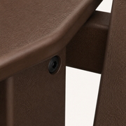 Hardware | close view of a dark round fastener joining two mahogany poly-lumber parts