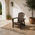Room 1 angle | one mahogany fan-back Adirondack chair from a high front-left angle in the limestone courtyard