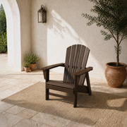 Room 1 angle | one mahogany fan-back Adirondack chair from a high front-left angle in the limestone courtyard