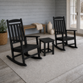 Coastal porch | Two black rocking chairs beside a black side table on a blue-gray porch