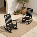 Courtyard angle | Two black rocking chairs together from a second courtyard view