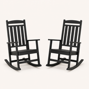 Studio angle | Two black rocking chairs from an angled view showing slatted seats and runners