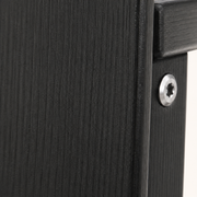 Texture | Close-up of black woodgrain texture on a rocking chair arm