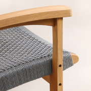 Close view | natural teak chair arm and upright joint with gray woven rope termination