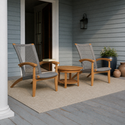 Blue-gray porch | two natural teak Adirondack chairs and a round slatted teak side table