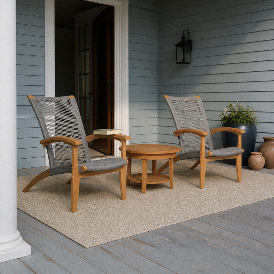 Blue-gray porch | two natural teak Adirondack chairs and a round slatted teak side table
