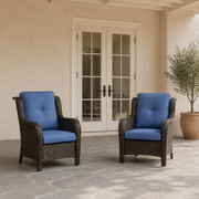 In scale | two blue-cushioned wicker patio chairs beside a fully visible exterior doorway