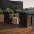 Rooftop | two blue-cushioned brown wicker patio chairs on a redwood deck at golden hour