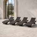 Scale | four dark brown woven folding chaise lounges beside a full-height arched glass doorway
