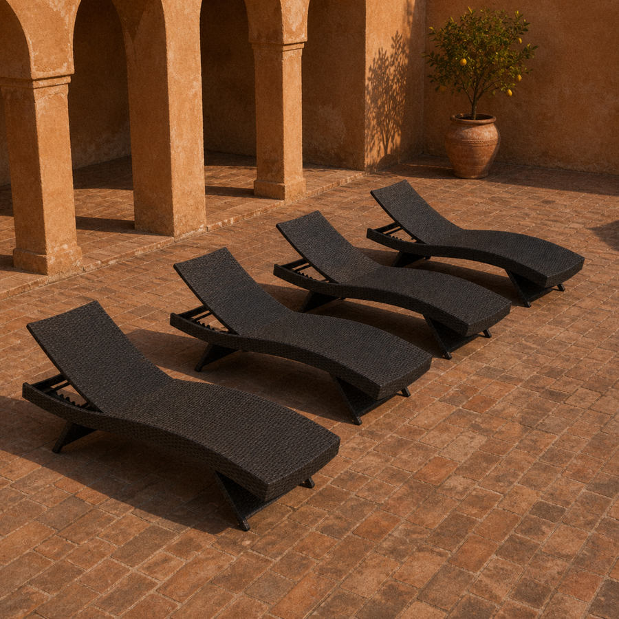 In a room | four dark brown woven folding chaise lounges in a terracotta courtyard