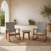 In a room | sunlit courtyard with two eucalyptus rocking chairs and a round slatted side table