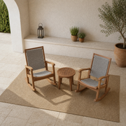 Second courtyard angle showing the complete two-chair and round side-table set
