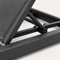Hardware | close view of the dark charcoal reclining support strut and pivot