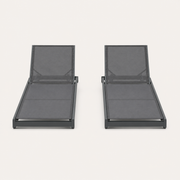 Front | front studio view of two gray mesh reclining chaise lounges with dark charcoal frames