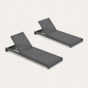 Studio | three-quarter studio view of the matching gray mesh chaise lounge pair