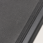 Texture | close view of gray outdoor mesh sling weave and dark charcoal frame rail