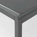 Detail | close view of the squared charcoal aluminum frame corner and grey mesh sling edge