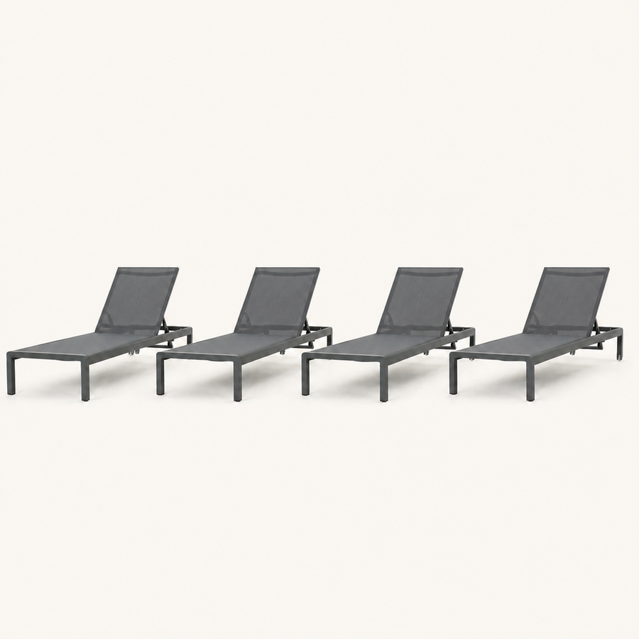 Front | four matching dark charcoal chaise lounges on a clean studio ground, with grey mesh sling seats and raised backs