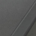 Texture | close view of the grey woven outdoor mesh sling stretched into the charcoal aluminum frame