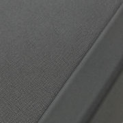 Texture | close view of the grey woven outdoor mesh sling stretched into the charcoal aluminum frame