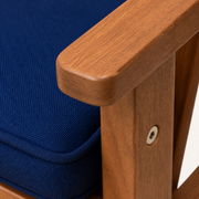 Texture | navy cushion weave and natural acacia arm rail with recessed silver fastener