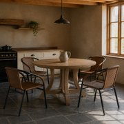 Beamed kitchen | four Medium Brown woven-rattan armchairs around a light wood table on slate tile, window at right