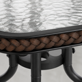 Hardware | extreme close-up of rippled glass, dark-brown woven table edge, and black steel hub