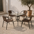 Complete five-piece patio dining set on a sunlit limestone courtyard