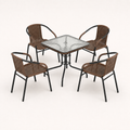 Studio | three-quarter studio view of the glass-top table and four matching woven armchairs