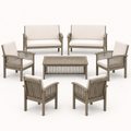 Front studio | full conversation set with two loveseats, four armchairs, and a low slat-top coffee table