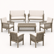 Front studio | full conversation set with two loveseats, four armchairs, and a low slat-top coffee table