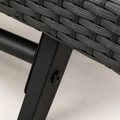 Hardware | close view of a black powder-coated iron lounger support with its round bolt beneath gray wicker