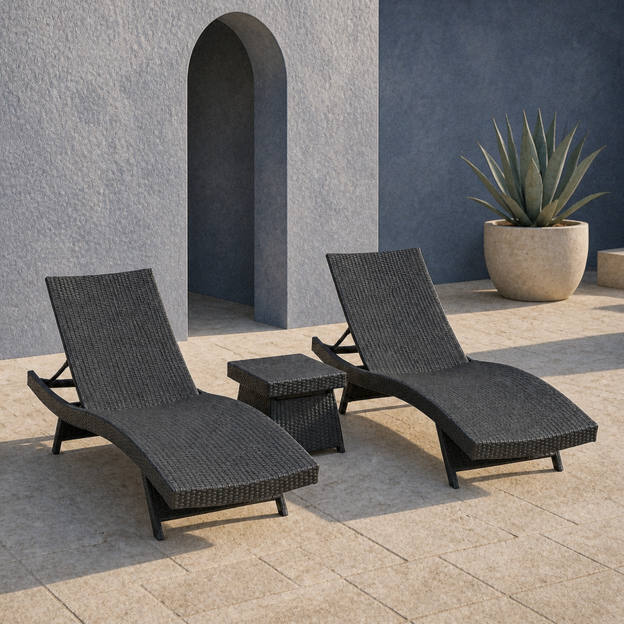 In a room | two charcoal-gray woven chaise loungers and a matching side table in a blue-gray courtyard