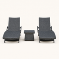 Front | front studio view of two charcoal-gray woven chaise loungers with a matching side table