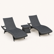 Studio | three-quarter studio view of two charcoal-gray woven chaise loungers with a matching side table
