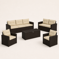 Studio angle | sofa, loveseat, two armchairs, and storage table on a warm paper background