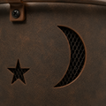 Texture | extreme close view of weathered bronze bowl patina with star and crescent cutouts and mesh