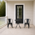 Scale | scale view of black iron bistro set beside full-height porch doorway