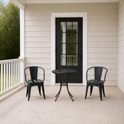 Scale | scale view of black iron bistro set beside full-height porch doorway