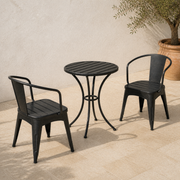 Three-piece black iron bistro set from second courtyard angle