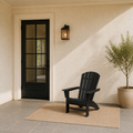 Scale | black Adirondack chair beside a full-height exterior doorway