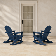 Scale | two navy blue rocking Adirondack chairs beside a full-height glass exterior door