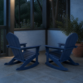 Garden veranda | two navy blue rocking Adirondack chairs on a slate floor in cool evening light