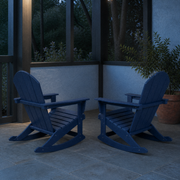 Garden veranda | two navy blue rocking Adirondack chairs on a slate floor in cool evening light
