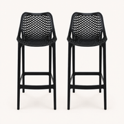 Front | two black lattice bar stools side by side on a light studio backdrop, front elevation and footrests visible