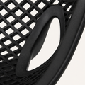 Arm detail | matte-black teardrop arm opening beside the continuous rim and open lattice